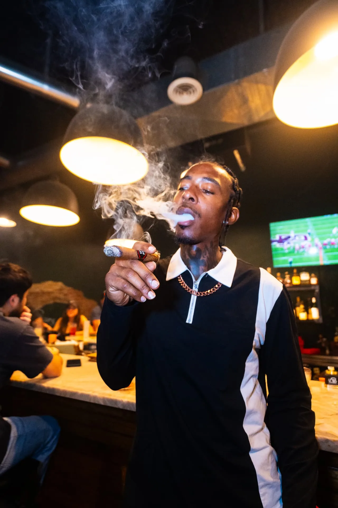 Guest enjoying a cigar inside the lounge
