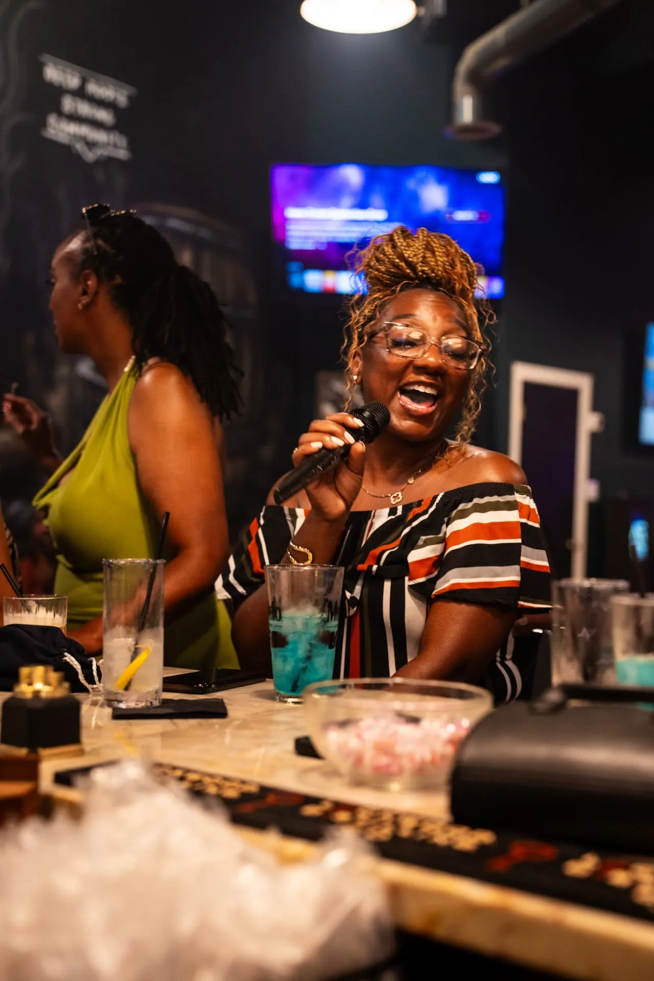 Guest singing at the Ash & Barrel bar