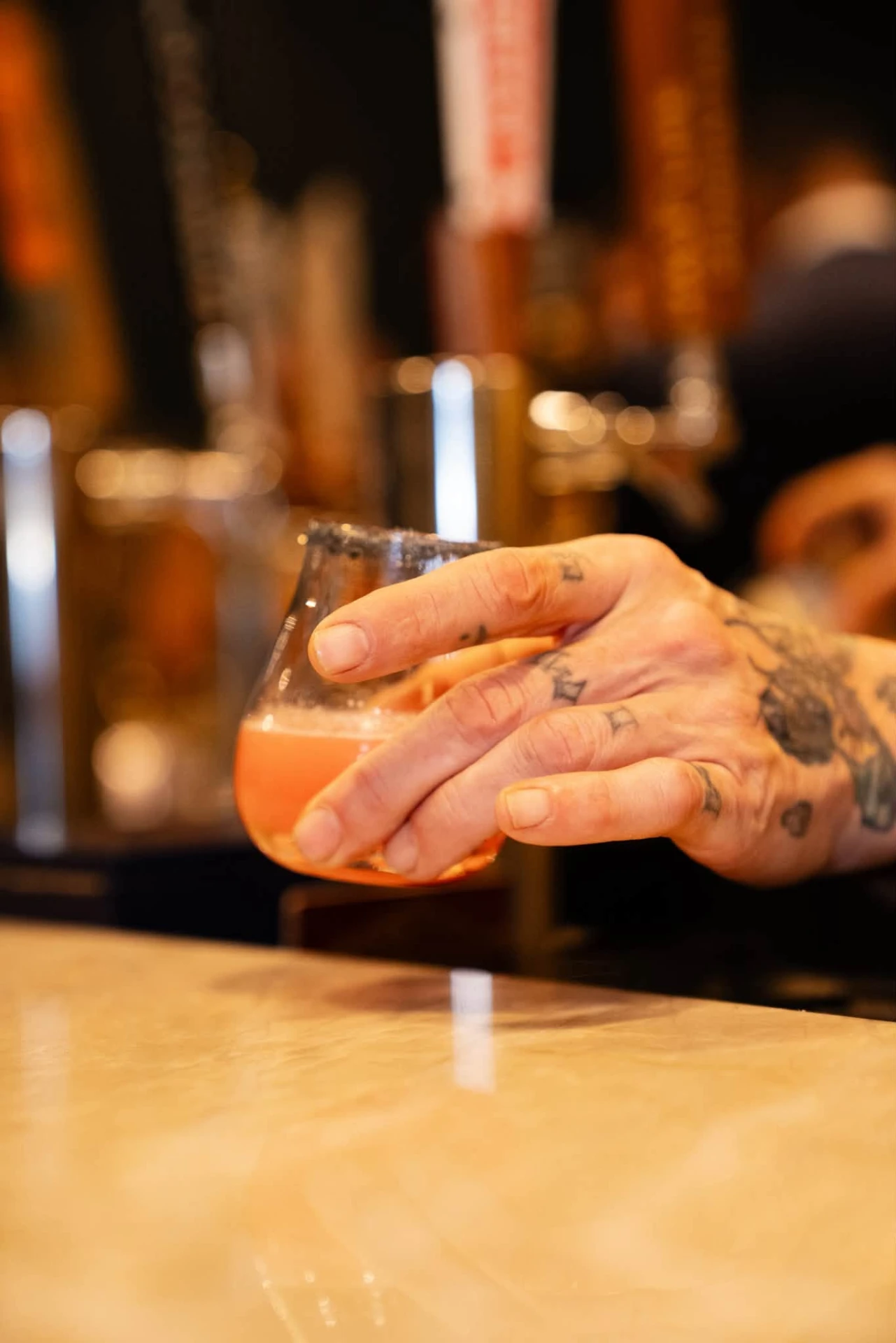 Cocktail raised at the Ash & Barrel bar