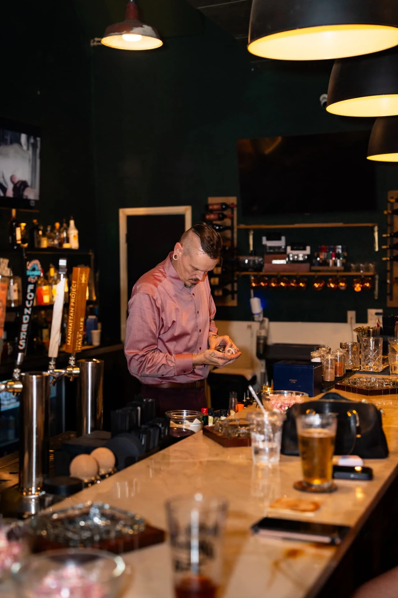 Bartender preparing the bar for the evening