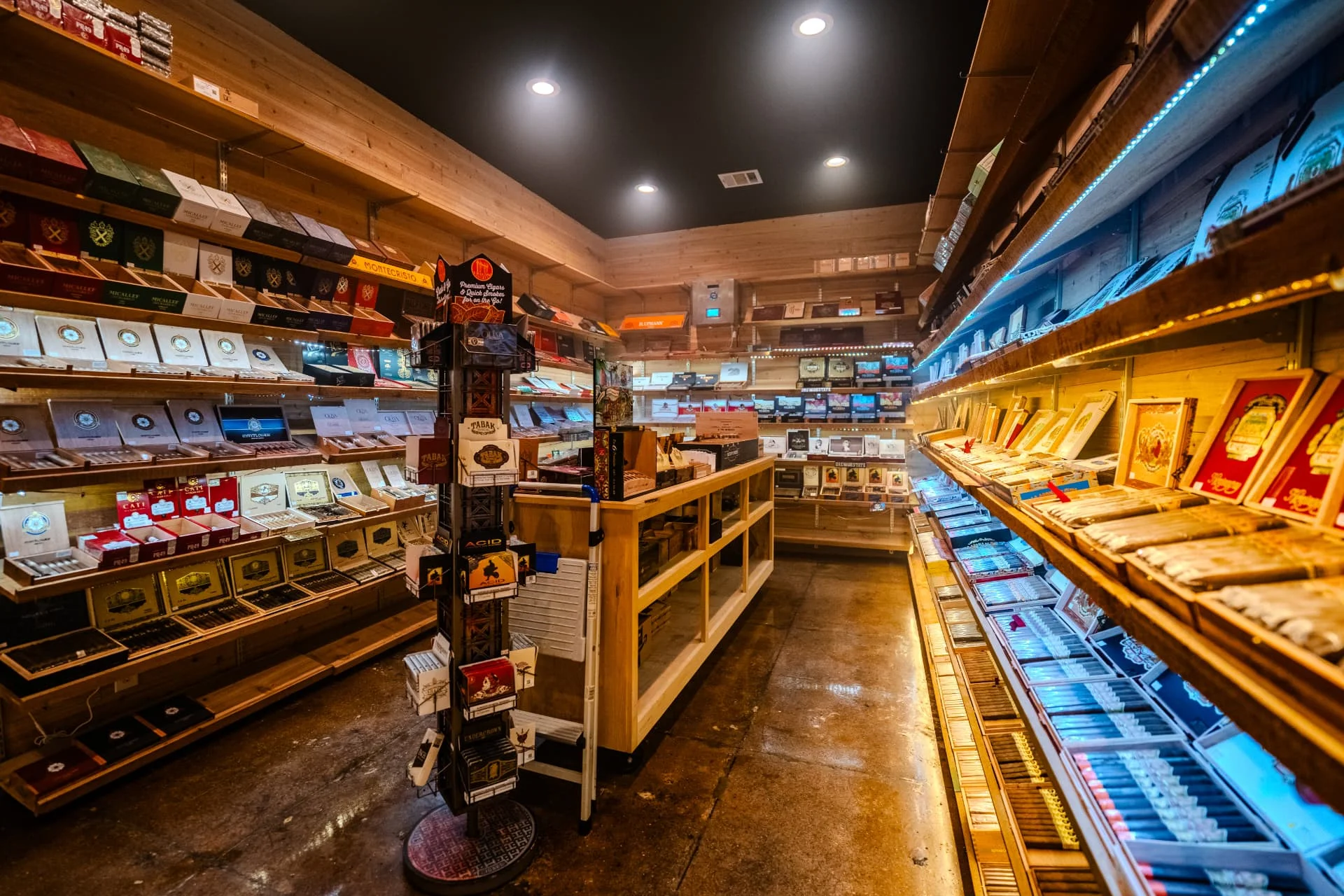 Walk-in humidor at Ash & Barrel in Sherman, Texas, stocked with premium cigar boxes