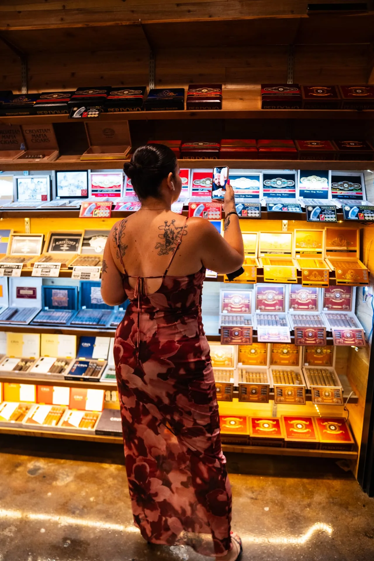 A guest browsing cigars in the Ash & Barrel humidor