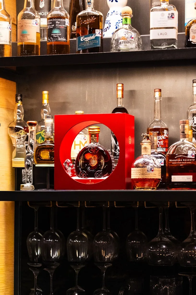 Whiskey bottles and hanging glassware